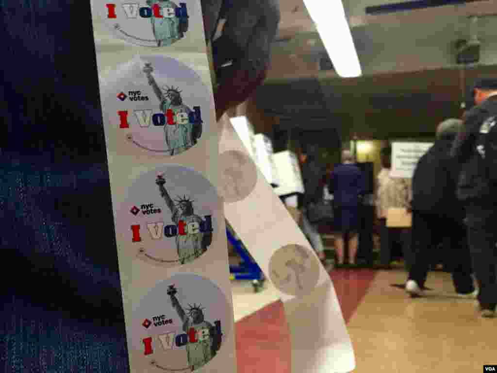 "I voted" stickers are given to people after turning in their ballots to election officials at the 2nd Canaan Baptist Church in Central Harlem, New York, April 19, 2016. (R. Taylor / VOA)
