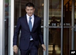 FILE- Ousted Uber CEO Travis Kalanick leaves federal court in San Francisco, Feb. 7, 2018.
