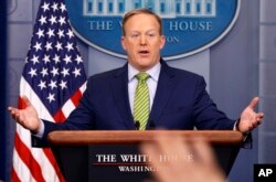 FILE - White House press secretary Sean Spicer speaks during the daily press briefing at the White House in Washington, Feb. 2, 2017. Spicer said the type of change made Thursday regarding a change in sanctions on Russia was a "fairly common practice."