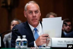 FILE - Interior Secretary Ryan Zinke attends a hearing on Capitol Hill in Washington, May 10, 2018.