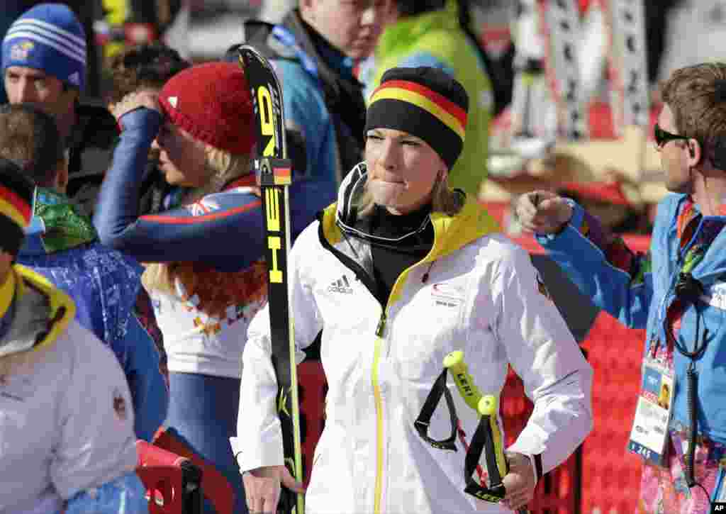 Germany's Maria Hoefl-Riesch leaves the finish area after competing in the downhill portion of the women's supercombined, Krasnaya Polyana, Russia, Feb. 10, 2014.