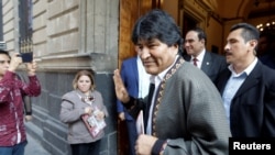 FILE - Bolivia's former President Evo Morales gestures after a news conference, in Mexico City, Mexico, Nov. 27, 2019. 