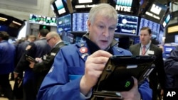 Trader Richard Newman works on the floor of the New York Stock Exchange, Feb. 7, 2018.