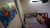 A Pakistani asylum seeker, photographed in January, hides in a small apartment on Bangkok’s edge. Lacking legal status, refugees scrape by while awaiting resettlement. Some have been caught up in Thailand's efforts to curb human trafficking.