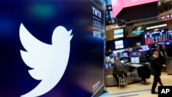 FILE - The logo for Twitter is displayed above a trading post on the floor of the New York Stock Exchange on Feb. 8, 2018. 