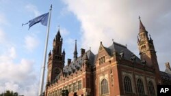 A United Nations flag flutters in the wind next to the International Court of Justice in the Hague, the Netherlands, Aug. 27, 2018. Iran has been pressing the court to have U.S. sanctions against Tehran lifted.