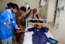 Injured victims of a bomb blast are treated at a hospital in Quetta, Pakistan, April 21, 2021.