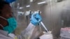 Puseletso Lesofi prepares to sequence COVID-19 omicron samples at the Ndlovu Research Center in Elandsdoorn, South Africa on Dec. 8, 2021. The centre ls part of the Network for Genomic Surveillance in South Africa, which discovered the omicron variant.