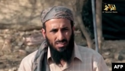 FILE - AQAP chief Nasir al-Wuhayshi allegedly addressing scores of jihadists at an undisclosed location in Yemen.