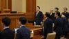 (FILES) South Korea's impeached president Yoon Suk Yeol (C) stands as he attends the fourth hearing of his impeachment trial over his short-lived imposition of martial law at the Constitutional Court in Seoul on Jan. 23, 2025.