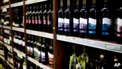 FILE - Bottles of wine produced in a Jewish settlement in the West Bank are on display at a supermarket in Jerusalem Wednesday, Nov. 11, 2015.