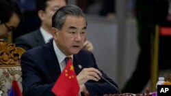 FILE - Chinese Foreign Minister Wang Yi speaks during the Special ASEAN-China Foreign Ministers' meeting on the Novel Coronavirus Pneumonia in Vientiane, Laos, Feb. 20, 2020.