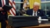 Trump defends pardons, fires political appointees, unveils infrastructure investment