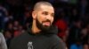 FILE - Drake attends an NBA game. 