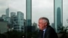 FILE - Former Hong Kong Governor Chris Patten sits in a hotel restaurant overlooking Hong Kong's financial Central district during an interview by Reuters in Hong Kong, March 15, 2012.