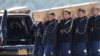 Coffins of the victims of Malaysia Airlines MH17 downed over rebel-held territory in eastern Ukraine, are loaded into hearses on the tarmac during a national reception ceremony at Eindhoven airport, July 23, 2014.