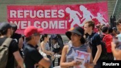 FILE - People gather for an anti-racism rally in downtown Toronto, Aug. 11, 2018. Canada announced Wednesday plans to increase deportations of immigrants in the country illegally.