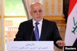 FILE - Iraqi Prime Minister Haider Al-Abadi speaks at the Elysee Palace in Paris, France, Oct. 5, 2017.