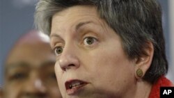 Janet Napolitano, right, Secretary of the Department of Homeland Security, answers a reporter's question during an NFL Super Bowl Security news conference in Dallas, Texas, January 31, 2011