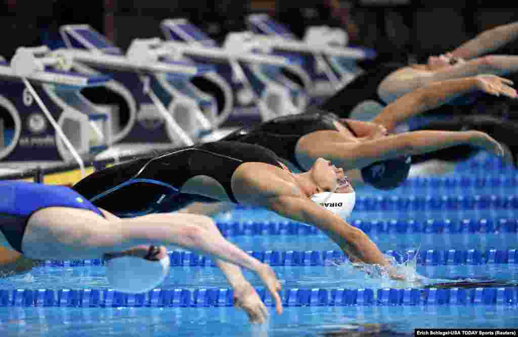 Maya Dirado dives off the starting block during the women's 200m backstroke preliminary heats in the U.S. Olympic swimming team trials at CenturyLink Center in Omaha, Nebraska.