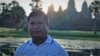 រូបឯកសារ៖ លោក ឡៅ វណ្ណា ឈរថតនៅខាងមុខប្រាសាទអង្គរវត្ត ខេត្តសៀមរាប កាលពីឆ្នាំ ២០២០។ (រូបថតផ្ដល់ឲ្យដោយក្រុមគ្រួសារ) 