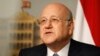 Lebanon's Prime Minister Najib Mikati speaks during a news conference at the Grand Serail, the government headquarters in Beirut, March 22, 2013. 