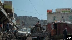 FILE - Fighters from a militia known as the Security Belt, that is funded and armed by the United Arab Emirates, head to the frontline in an area called Moreys, in Yemen's Dhale province, Aug. 5, 2019.