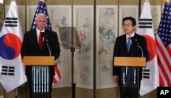 U.S. Vice President Mike Pence, left, speaks as South Korea's acting President and Prime Minister Hwang Kyo-ahn listens during a joint news conference after their meeting in Seoul, South Korea, April 17, 2017.