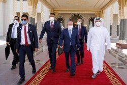 Israeli National Security Advisor Meir Ben-Shabbat, center, walks toward a plane as he leaves Abu Dhabi, Arab Emirates, Sept. 1, 2020.