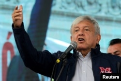 FILE - Mexico's President-elect Andres Manuel Lopez Obrador talks to supporters in Monterrey, Oct. 19, 2018.