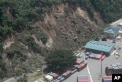 This image made from a video shows a landslide near an international shipping terminal in Port Vila, Vanuatu, following a powerful earthquake, Dec. 17, 2024.