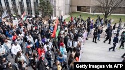 Tamika Palmer, mother of Breonna Taylor, and others lead a memorial march for Breonna Taylor near Jefferson Square Park on March 13, 2021, in Louisville, Kentucky.