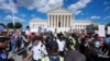 U.S. Supreme Court Police officers and U.S. Capitol Police officers place barriers between anti-abortion and abortion-rights demonstrators outside the Supreme Court, June 24, 2024, in Washington. 