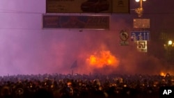 Protesters clash with police in central Kyiv, early Monday, Jan. 20, 2014.