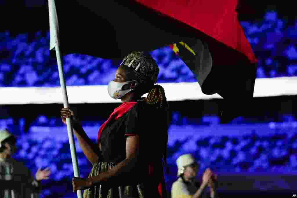 Natalia Santos of Angola, carry her country's flag during the opening ceremony in the Olympic Stadium at the 2020 Summer Olympics, July 23, 2021, in Tokyo, Japan.