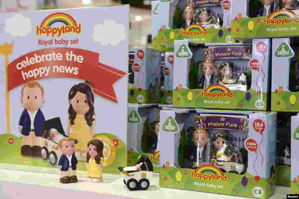 Models of Britain's Prince William and his wife Catherine, Duchess of Cambridge, and their newborn baby, are seen on sale in a Mothercare store, central London, July 23, 2013. 