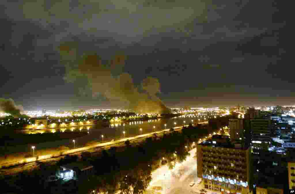 Smoke rises from the Iraqi Trade Ministry in Baghdad after it was hit by a missile during a U.S.-led attacks, March 20, 2003.