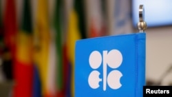 FILE - The logo of the Organization of the Petroleum Exporting Countries (OPEC) is seen inside its headquarters in Vienna, Austria, Dec. 7, 2018. 