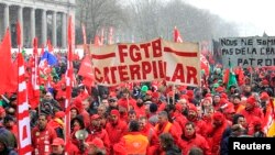 Workers and trade union representatives from all over Europe hold a demonstration against austerity near the European Commission and Council headquarters in Brussels, March 14, 2013.