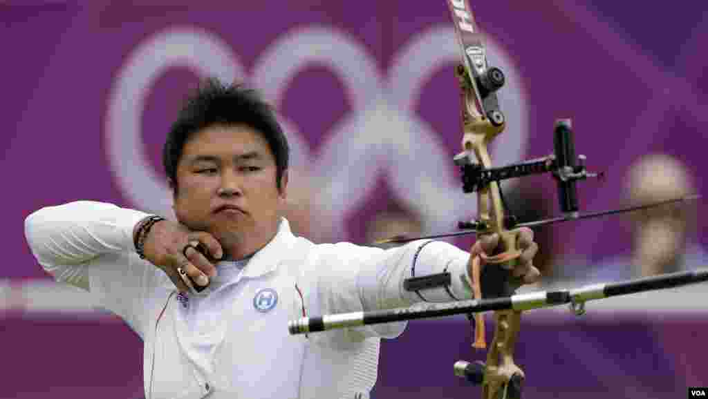 South Korea's Oh Jin-hyek shoots during an elimination round of the individual archery competition at the 2012 Summer Olympics, Aug. 1, 2012, in London.