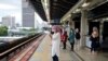 People wait for a Light Rail Transit train at a station, during a lockdown due to the coronavirus disease (COVID-19) outbreak, in Kuala Lumpur, Malaysia, Jan. 14, 2021.