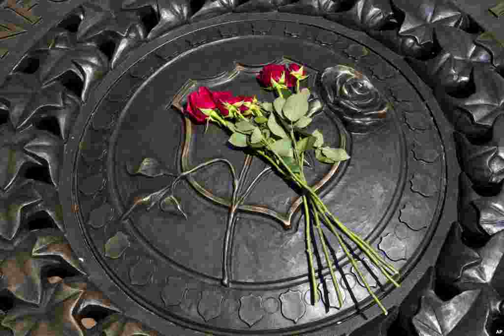 Five red roses are seen on the bronze medallion at The National Law Enforcement Officers Memorial in Washington, after five law enforcement officers were killed in Dallas on Thursday. The attack is one of the worst on U.S. law enforcement in 100 years and marks a grim milestone &mdash; the deadliest night for police officers since the terrorist attacks on Sept. 11, 2001.