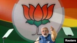 FILE - India's Prime Minister Narendra Modi addresses an election campaign rally ahead of the Karnataka state assembly elections in Bengaluru, India, Feb. 4, 2018.
