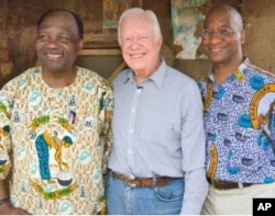 Feb. 15, 2007. Nasarawa, Nigeria. Former U.S. President and Founder of The Carter Center Jimmy Carter, stands with Carter Center Vice President of Health Programs, Dr. Donald Hopkins (right) and Guinea worm partner, former Nigerian Head of State General Y