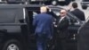 TOPSHOT - Former US President and 2024 hopeful Donald Trump disembarks his plane "Trump Force One" on arrival at Ronald Reagan Washington National Airport in Arlington, Virginia, on August 3, 2023.