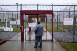 Attorney Matt Boles, 27, with the Southern Poverty Law Center's Southeast Immigrant Freedom Initiative, heads to immigration court at the Stewart Detention Center in Lumpkin, Ga., Nov. 15, 2019.
