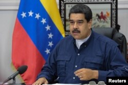 FILE - Venezuela's President Nicolas Maduro speaks during a Council of Ministers meeting at Miraflores Palace in Caracas, Venezuela, May 16, 2017.