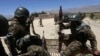 Afghan National Army soldiers patrol near polling stations in the outskirts of Kabul, June 12, 2014.