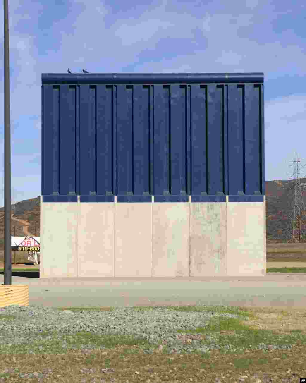 A border wall prototype stands in San Diego near the Mexico-U.S. border, seen from Tijuana, Mexico, Dec. 22, 2018. 