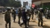 Nairobi anti-riot police disperse small groups of protesters with tear gas ahead of anti-electoral commission demonstrations, May 23, 2016. (Jill Craig/VOA)